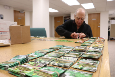 Volunteer sorts seed packets
