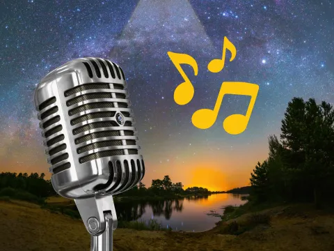 Image of a mountain lake with a sunset. A microphone is in the foreground with three yellow musical notes floating in the air.