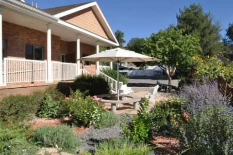 Lawn, porch, and entryway to the Hotchkiss Library building