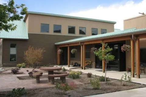 View of the Crawford Library building featuring courtyard and covered entryway.