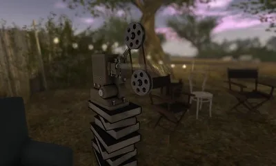 Movie projector sitting on a pile of books