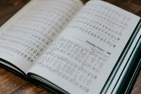 A music book open to Amazing Grace