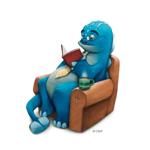 A blue dinosaur that is wearing glasses, sits on a recliner, reading a book.