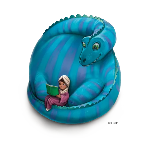 A person sits, reading a book, while being wrapped up in the tail of a blue dinosaur.